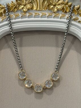 Gold and Rhodium Plated Two-Tone Triple CZ stones.